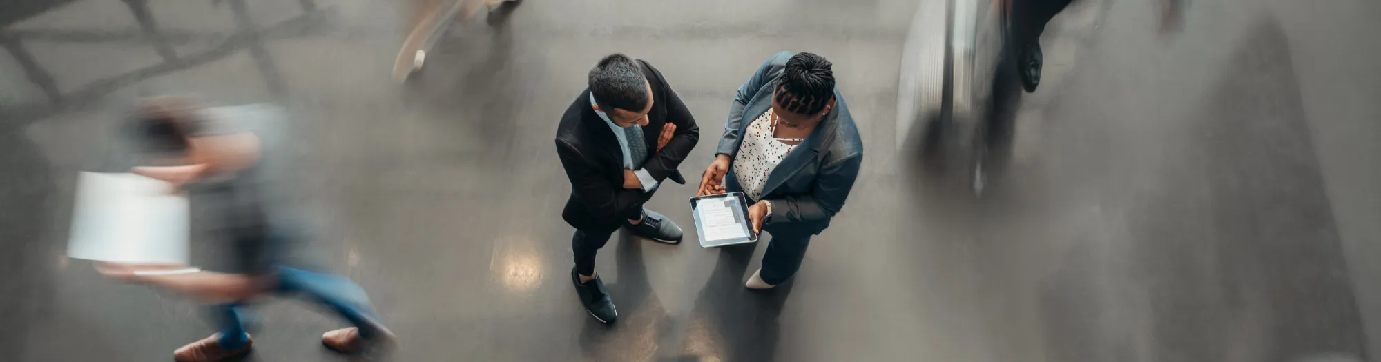 Two office workers communicating