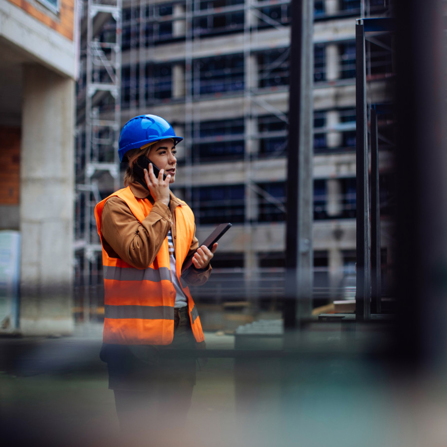 Female worker on the phone at a construction site