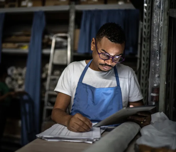 Male retail workering in a storage room